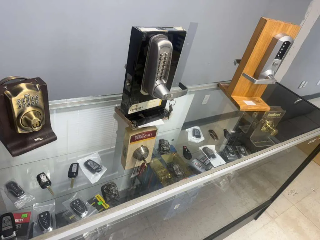Locksmith Solutions OKC showroom — smart fobs, keypad locks, deadbolts and Kwikset SmartKey on display